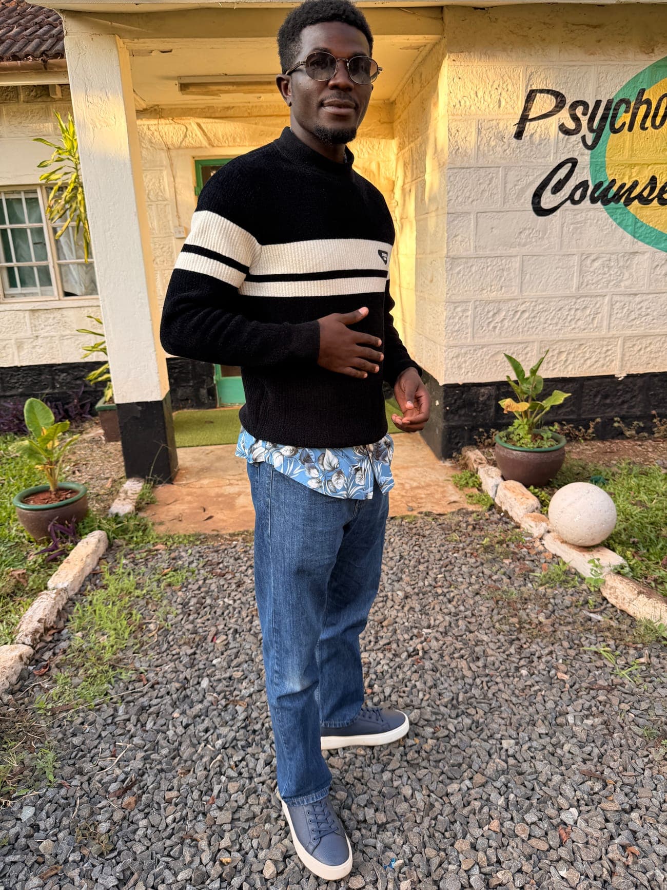 Mashel standing outside a building in Nairobi