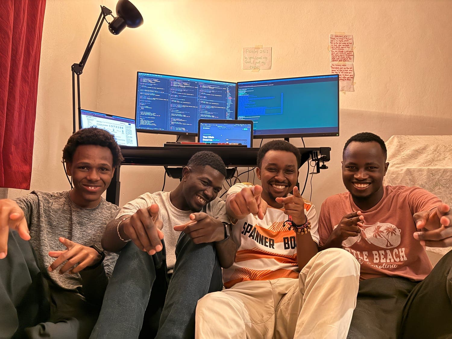 Mashel and friends in front of a multi-monitor coding setup